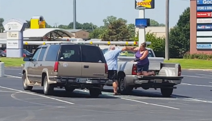husband beating wife in parkinglot