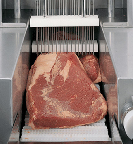 The machine uses small needles to inject meat with chemicals.