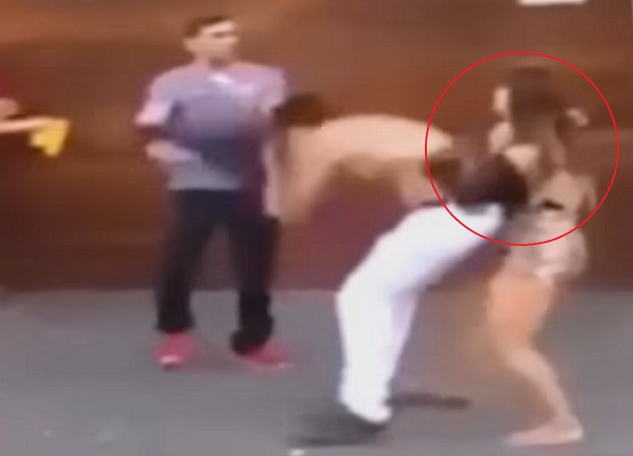 woman stops brawl